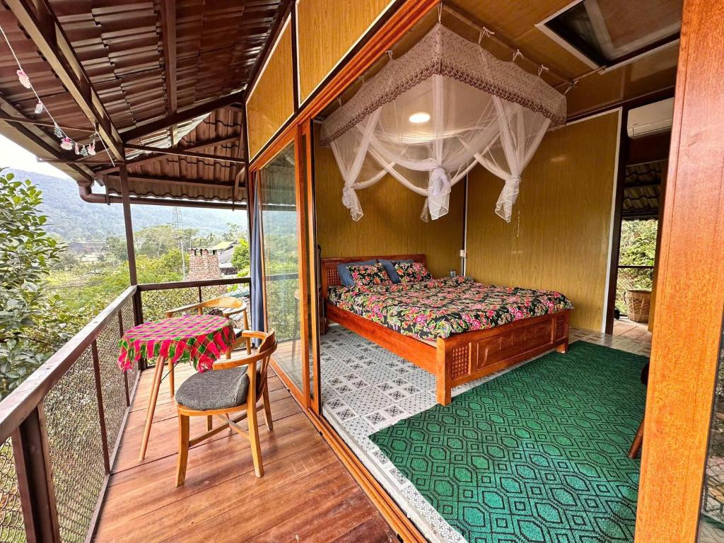 Airy double bedroom with balcony overlooking the rice fields at Homestay field